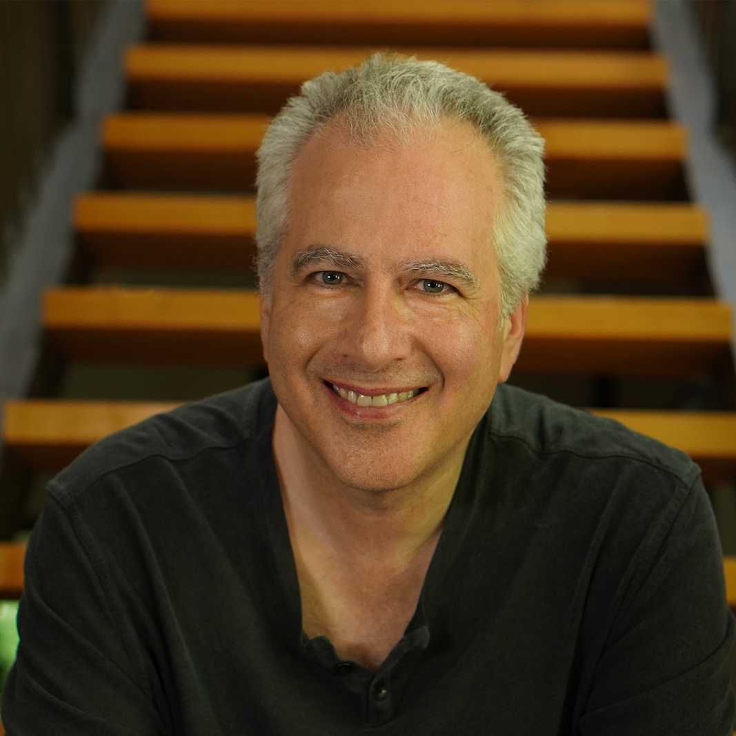 David Levine seated on a staircase